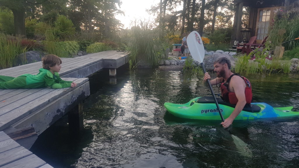 Kayak in natural swim pond